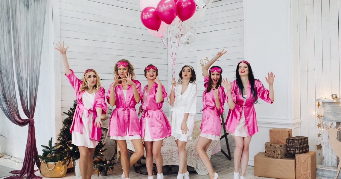 Bridesmaids and bride having fun at bachelorette party